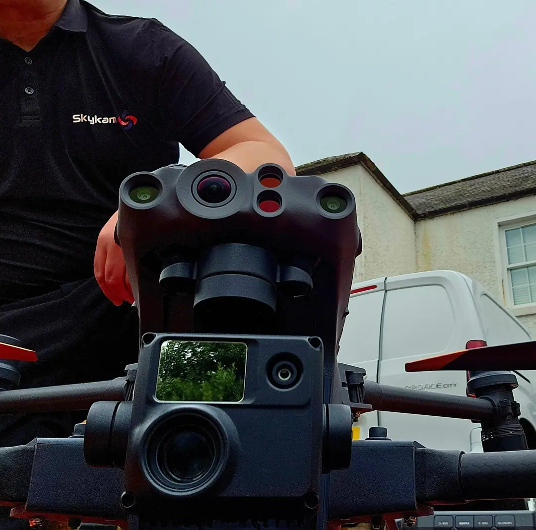 James Leslie preparing an enterprise survey drone with a multi-sensor payload